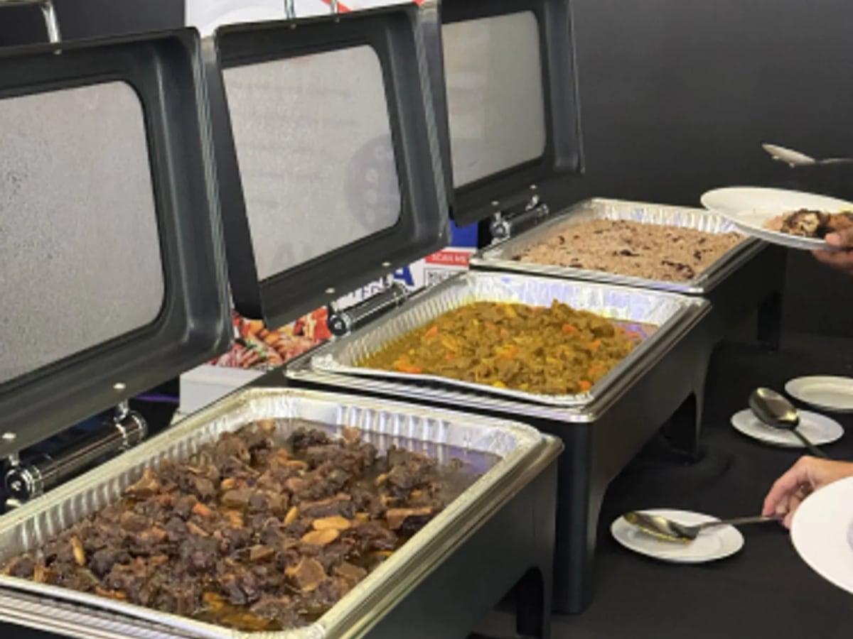A hot buffet line in chafing dishes ready for service
