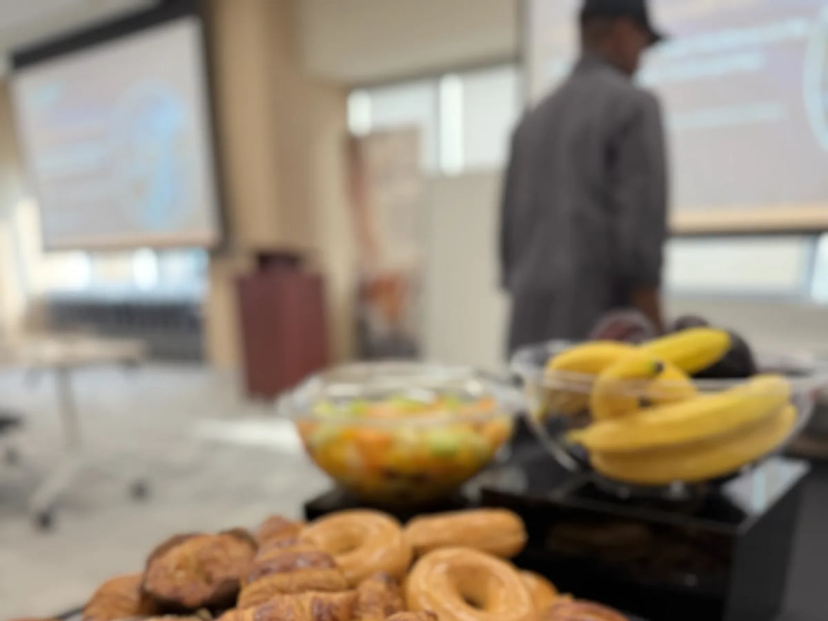 A tray of fresh pastries at a catered office breakfast